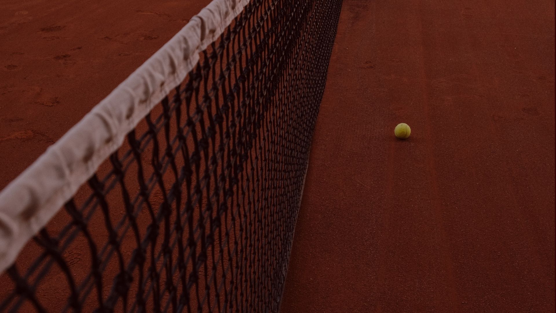 Padel court and net in warm terracotta tones